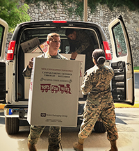 Marines unloading boxes for Toys for Tots