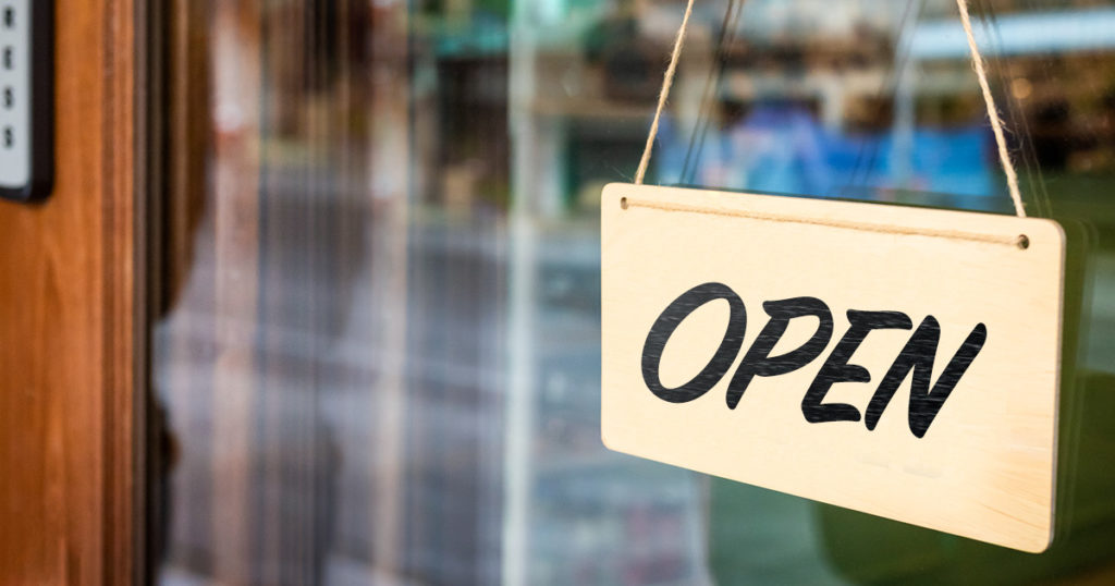 Open sign on store front.